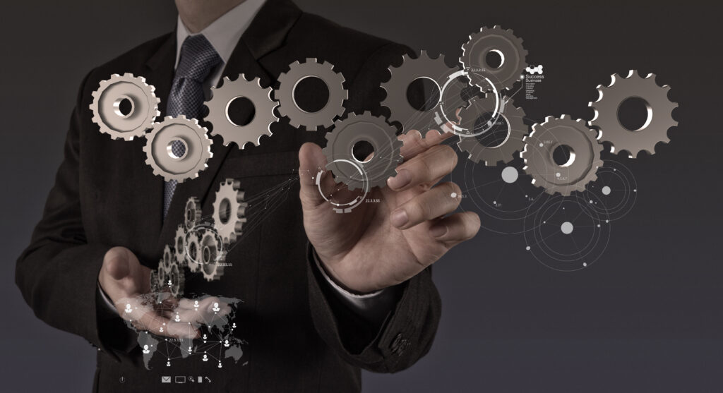 businessman hand show gear to success